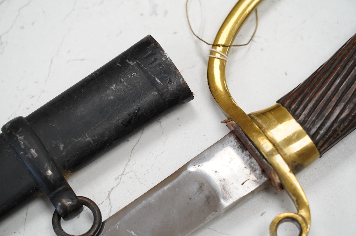 A 1920s Persian Cavalry Troopers sword Shashka, based on an 1881 pattern Russian Dragoons sword, in its scabbard numbered 21422, blade 79.5cm. Condition - generally good, scabbard painted black